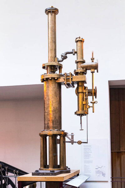 MUNICH, GERMANY - NOVEMBER 26, 2018 : The German Museum of Science and Technology Achievement represents the exposure of old mechanisms for the production of energy steam engines, windmills, electric generators. 