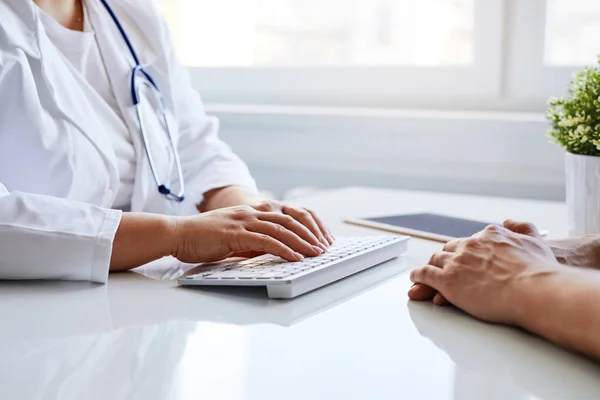 Doctor Working Computer Medical Office While Patient Sitting Him — ストック写真