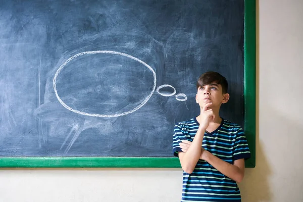 Boy Student Leaning On Blackboard And Thinking In Classroom — Stock Photo, Image