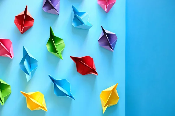 Fleet Of Authentic Origami Boats On Blue Background — Stock Photo, Image