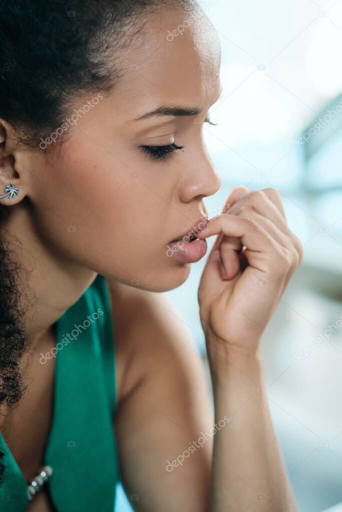 Young Black Woman Feeling Anxious And Biting Nails