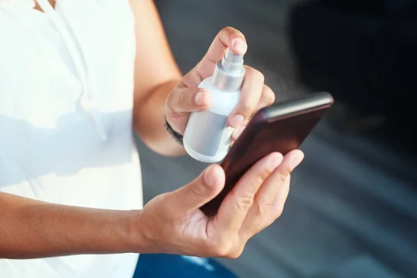 Woman Cleaning And Disinfecting Cell Phone Against Virus — Stock Photo, Image