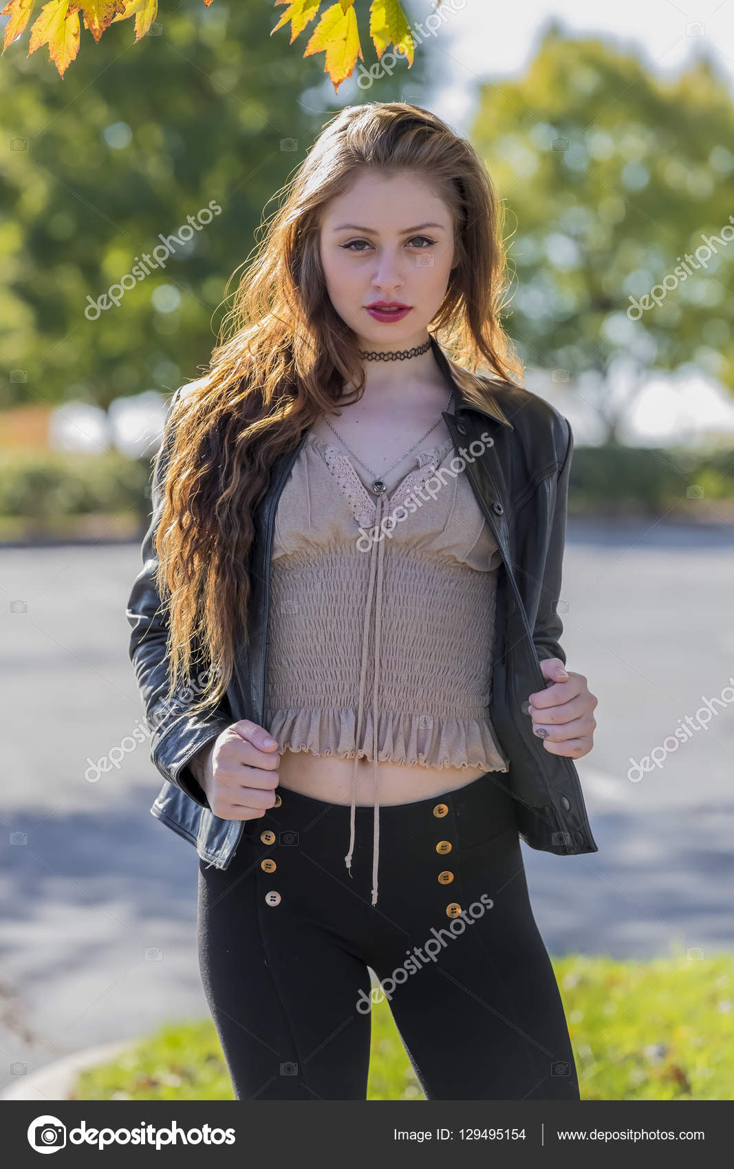 Sexy Coed Enjoying The Fall Foliage Stock Photo by