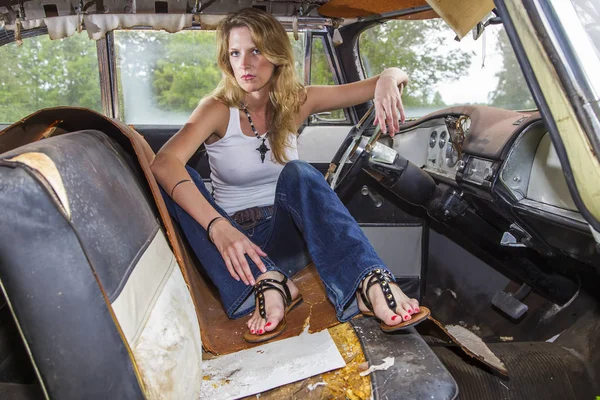 Blonde Model Posing With A Vintage Automobile Stock Photo