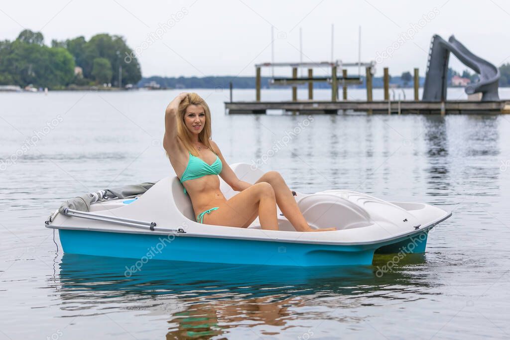 A gorgeous bikini model enjoying a day on the water