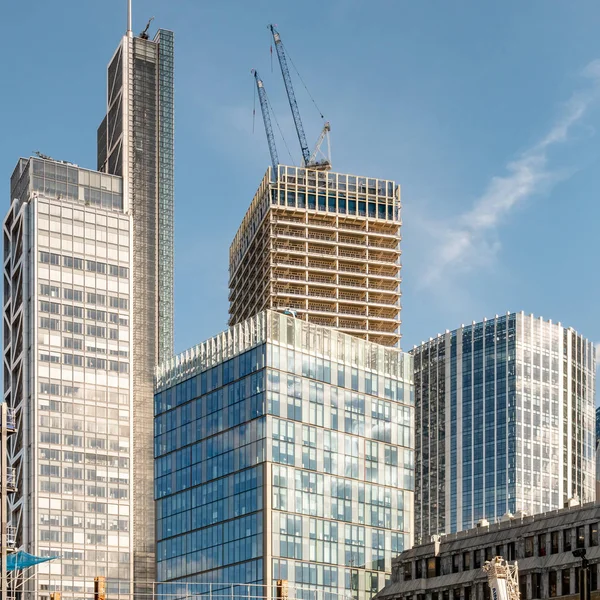 A modern skyscraper under construction in the heart of London financial district.