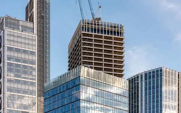 A modern skyscraper under construction in the heart of London financial district.