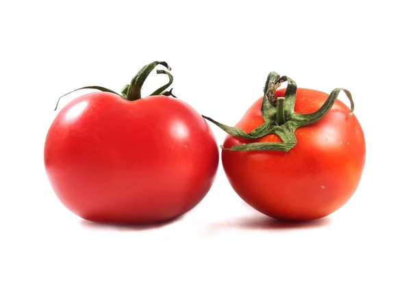 Tomates em um fundo branco. Comida, legumes, tomate vermelho . — Fotografia de Stock