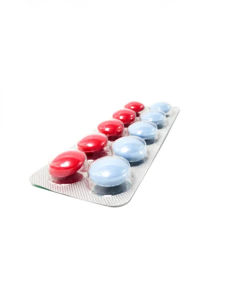 Compresse multicolori in confezione trasparente. Prodotti medici per mantenere una buona salute e benessere . — Foto Stock