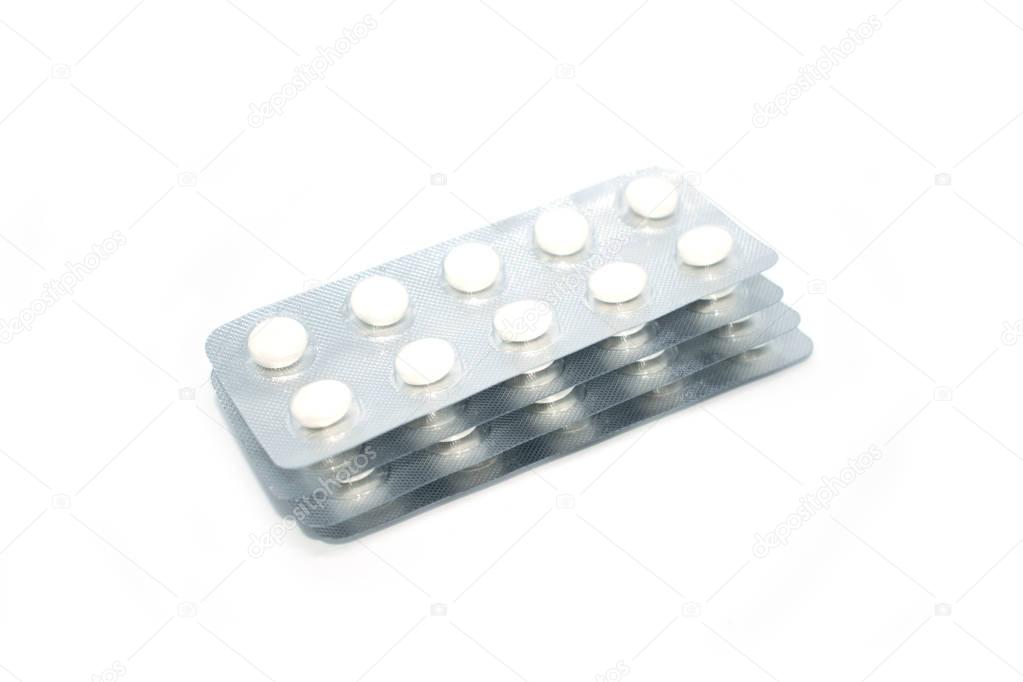 Multicolored tablets in transparent packaging. Medical products to maintain good health and well-being.