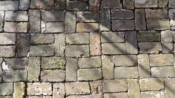 Textura de alvenaria. Cobblestone. Foto de pedra de pavimentação. Pedras naturais usadas na arquitetura . — Fotografia de Stock