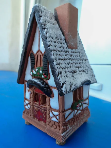 Photo of a gingerbread house. Souvenir, hanging in the form of a European house.