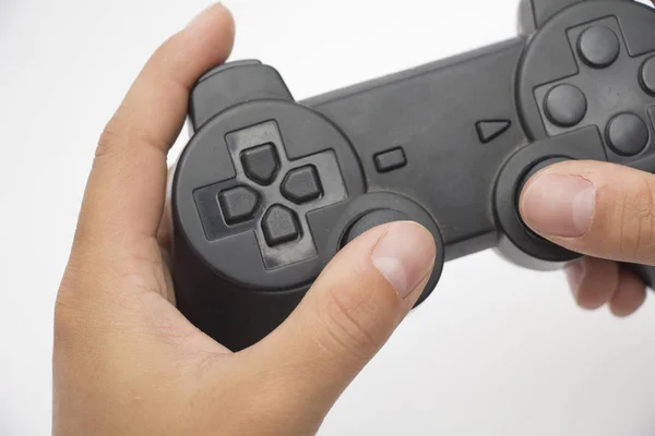 Händer som håller en gamepad Stockbild