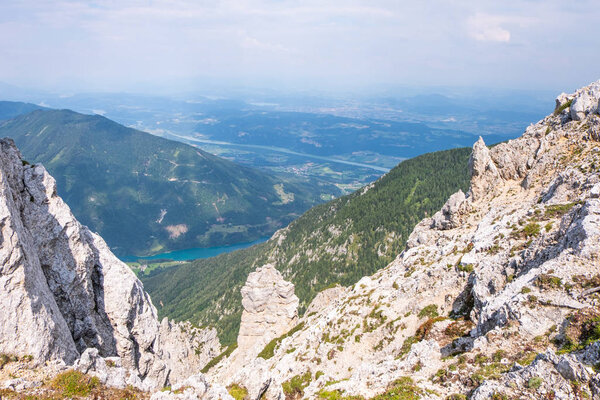 View from mountain Hochobir to valley Rosental, lake Freibach Stausee