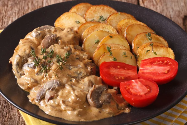 Diana steak with mushrooms and cream sauce close-up. horizontal