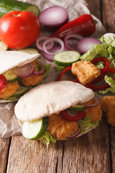 Tasty pita with chicken nuggets, cucumber, nappa cabbage, onion — Stock Photo, Image