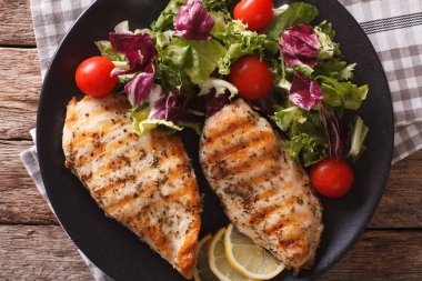 Grilled chicken breast with mixed salad close-up. horizontal top clipart