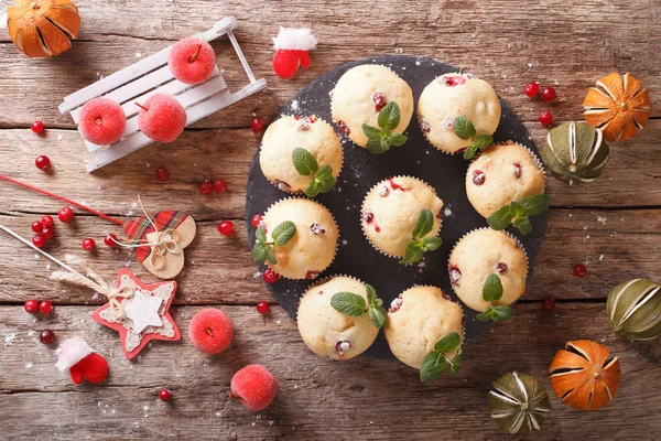 Christmas cranberry muffins decorated with mint closeup. horizon — Stock Photo, Image