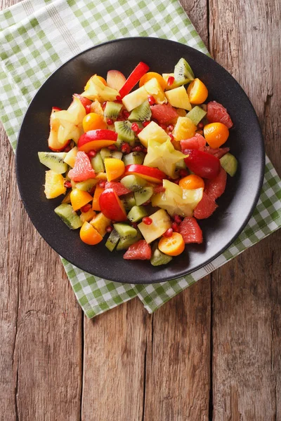 Fruit salad with orange, kumquat, pineapple, carambola, grapefru — Stock Photo, Image