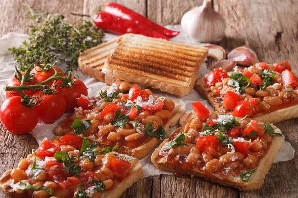 English breakfast: toast with white beans, tomatoes, cheese and
