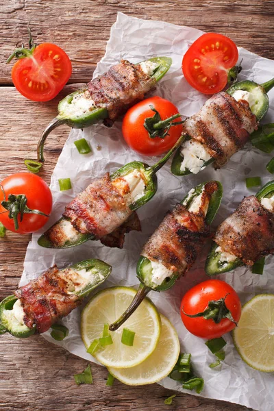 Roasted jalapeno peppers stuffed with cheese wrapped in bacon cl — Stock Photo, Image