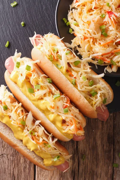 Tasty sandwich with sausage, sauerkraut and mustard close up. Ve — Stock Photo, Image