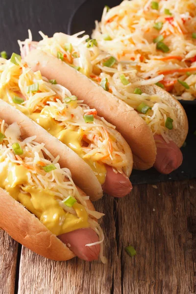 Delicious hot dog with sausage, sour cabbage and mustard close-u — Stock Photo, Image