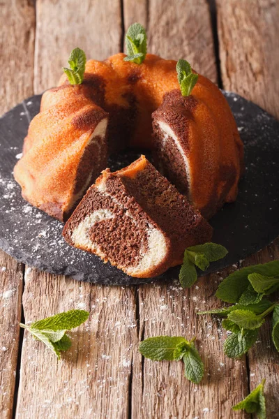 Closeup of a marble cake with vanilla and cocoa closeup.  Vertic