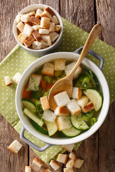 Delicious bread soup with zucchini and greens close-up in a bowl — Stock Photo, Image