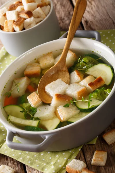 Delicious bread soup with zucchini and greens close-up in a bowl — Stock Photo, Image