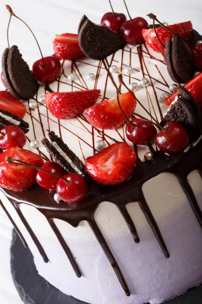 Cheesecake with strawberry and cherry, decorated cookies and cho — Stock Photo, Image