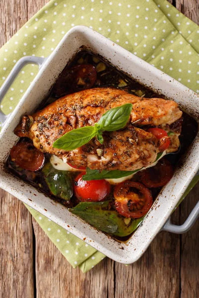 Delicious chicken fillet baked with caprese close-up in a baking — Stock Photo, Image