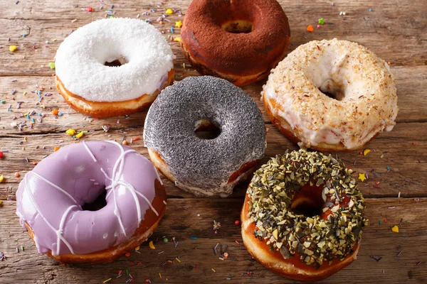 Different donuts confectionery sprinkling close-up. horizontal — Stock Photo, Image