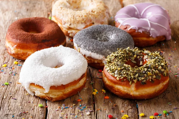 Freshly baked donuts covered with glaze close-up. horizontal — Stock Photo, Image