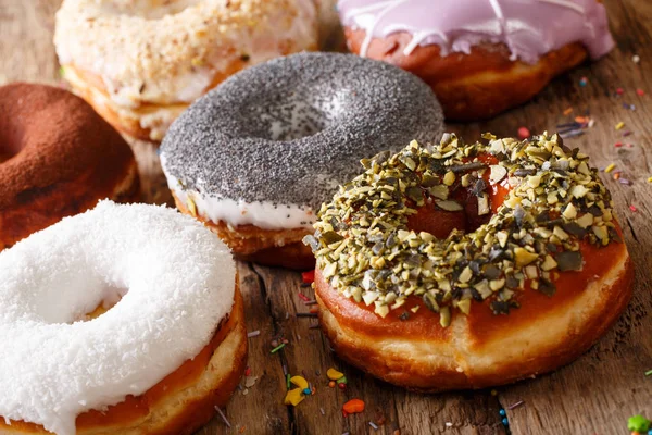 Homemade glazed multicolored donuts close-up. horizontal — Stock Photo, Image