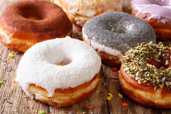 Delicious glazed multicolored donuts close-up. horizontal — Stock Photo, Image
