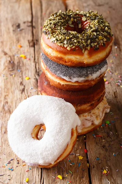 Stack of glazed multicolored donuts close-up. vertical — Stock Photo, Image