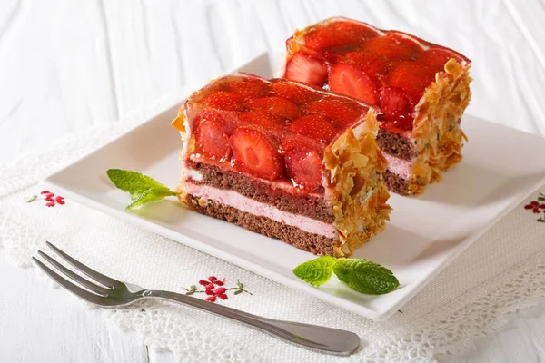 Beautiful strawberry jelly cake with almonds close-up. horizonta