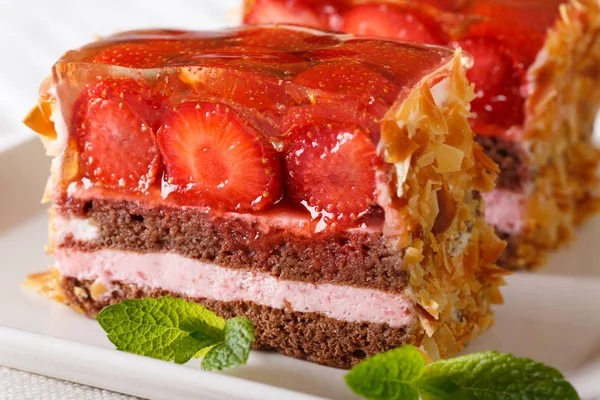 freshly cooked strawberry chocolate cake with jelly closeup on a