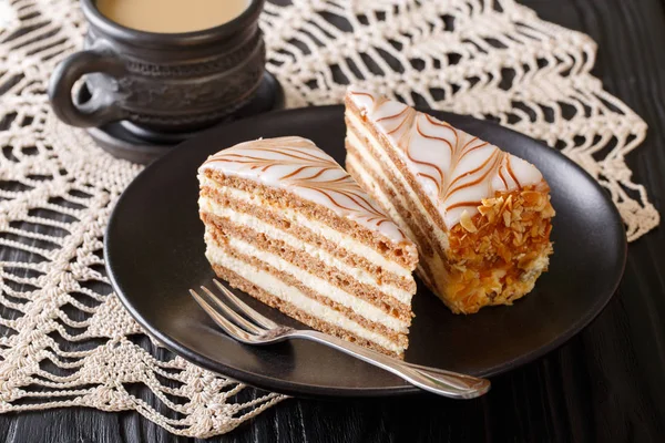 Beautiful sliced cake Eszterhazy and coffee with milk close-up. — Stock Photo, Image