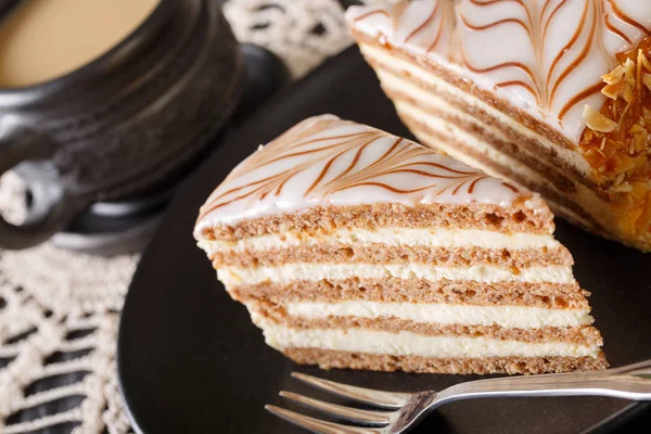 Tasty Hungarian Esterhazy cake on a plate and coffee close-up. v — Stock Photo, Image