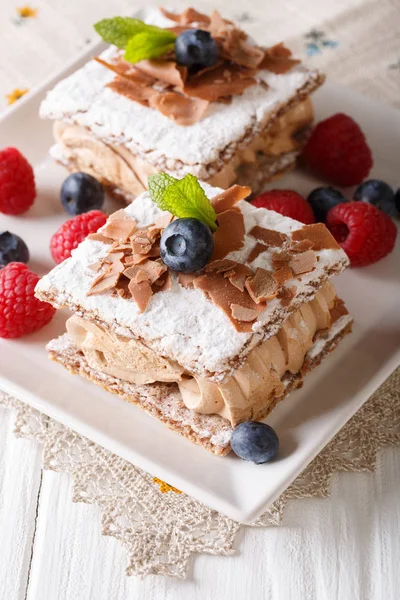 Millefeuille with coffee cream, decorated with berries and mint — Stock Photo, Image