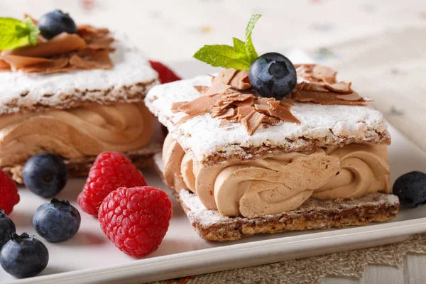 Millefeuille chocolate, decorated with berries and mint macro on — Stock Photo, Image