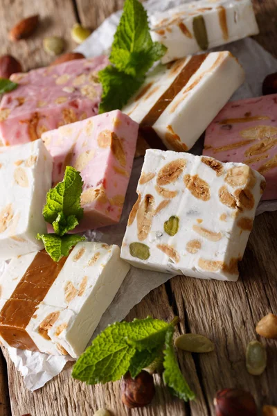 Freshly prepared honey nougat with nuts close-up. vertical — Stock Photo, Image