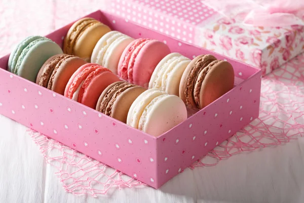Multicolored macaroons in a gift box close-up. Horizontal — Stock Photo, Image