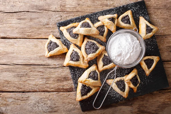Hamentashen triangular cookies with poppy seed for Purim holiday — Stock Photo, Image