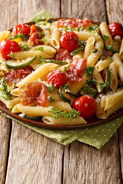 Italian cuisine: penne pasta with fried prosciutto, cherry tomat — Stock Photo, Image
