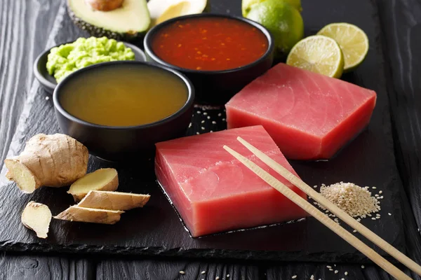 Raw fresh tuna fillet with chili and pineapple sauces and other — Stock Photo, Image