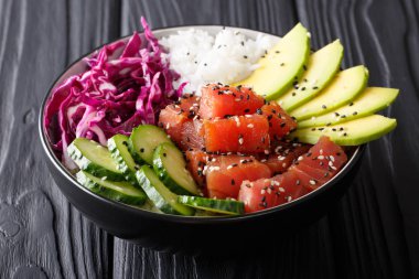 Organic food: tuna poke bowl with rice, fresh cucumbers, red cab clipart