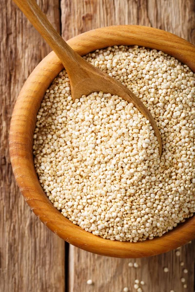Dry white quinoa in a bowl macro. top view vertical background — Stock Photo, Image
